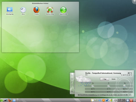 Die KDE-Arbeitsfl&auml;che l&auml;sst sich mit Plasmoids schm&uuml;cken. 