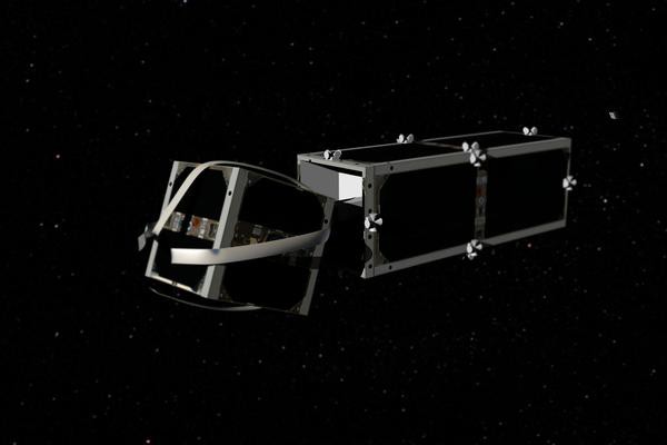 ... und packt den zu entsorgenden Satelliten. Anschließend geht es für beide abwärts (Bild: EPFL)